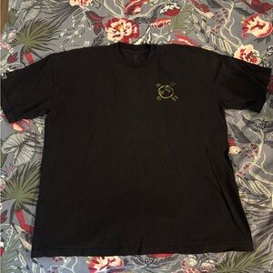 tde. Black Short-Sleeve Tee with Small Gold Chest Graphic